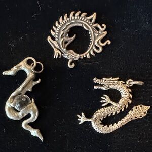 Three Silver-Tone Dragon Pendants
